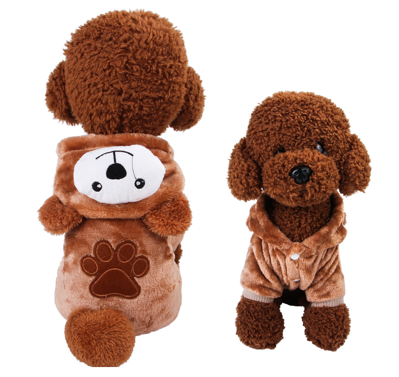 Two brown plush toys resembling dogs on a white background