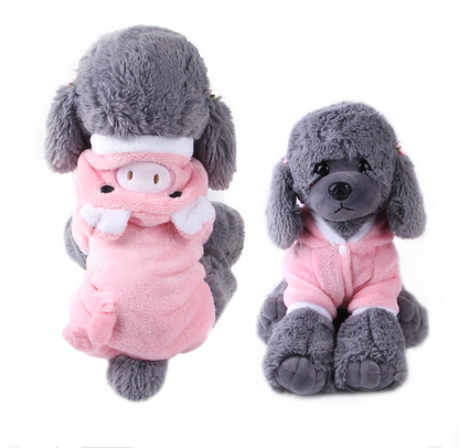 Two plush toys resembling dogs in pink outfits on a white background